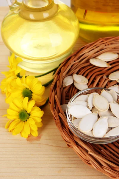 Useful linseed oil and pumpkin seed oil on wooden table close-up — Zdjęcie stockowe