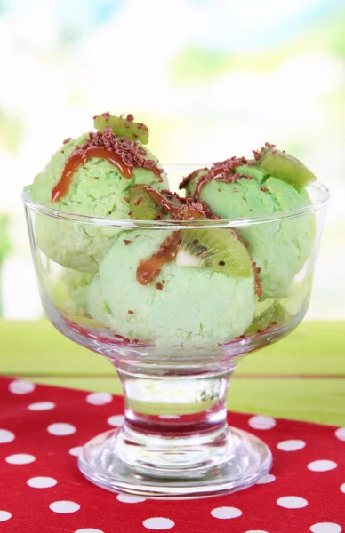 Delicious ice cream on table on bright background — Stock Photo, Image