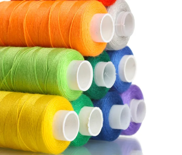 Pyramid of many-coloured bobbins of thread isolated on white — Stock Photo, Image