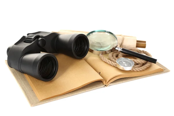 Black modern binoculars with old notebook isolated on white — Stock Photo, Image