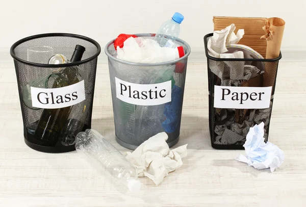 Three buckets of assorted debris on room background — Stock Photo, Image