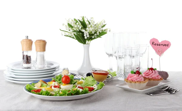 Table setting on tablecloth — Stock Photo, Image