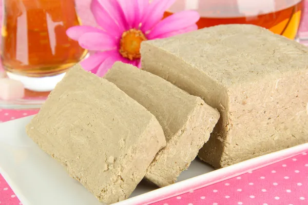 Tasty halva with tea on table close-up — Stock Photo, Image