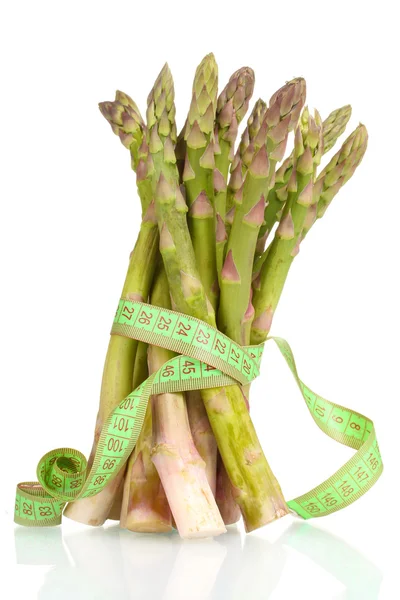 Delicious asparagus and measuring tape isolated on white — Stock Photo, Image