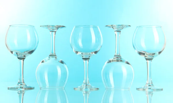 Glasses on light blue background — Stock Photo, Image