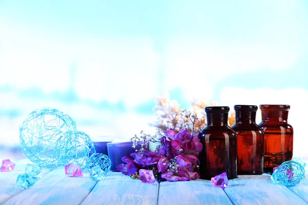 Spa oil and freesia on light background — Stock Photo, Image