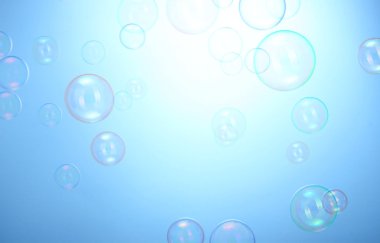 Soap bubbles on blue background clipart