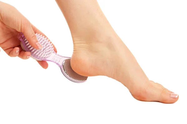 Woman having her foot scrubbed, isolated on white — Stock Photo, Image