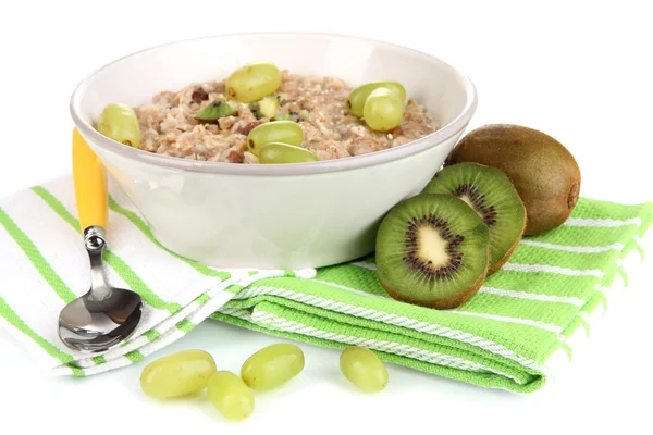 Harina de avena útil en tazón con fruta aislada en blanco — Foto de Stock