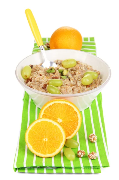 Useful oatmeal in bowl with fruit isolated on white — Stock Photo, Image