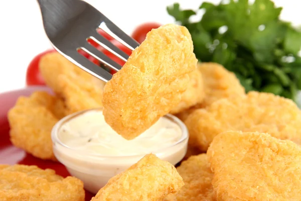 Fried chicken nuggets with vegetables and sauce isolated on white — Stock Photo, Image