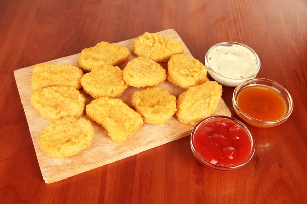 Fried chicken nuggets with sauce on table — Stock Photo, Image