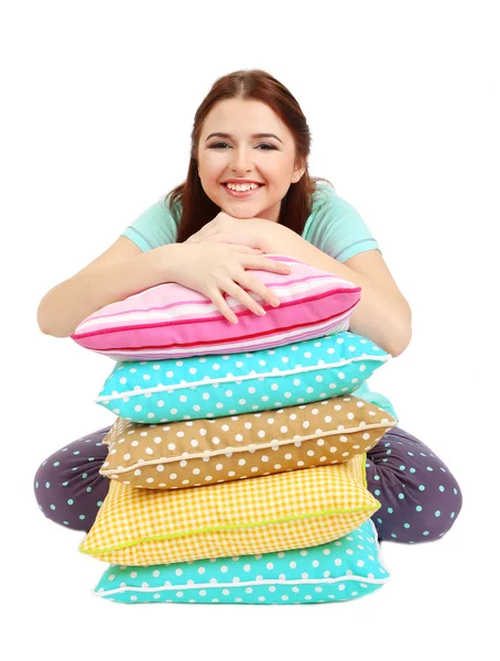 Beautiful young girl with pillows isolated on whit — Stock Photo, Image