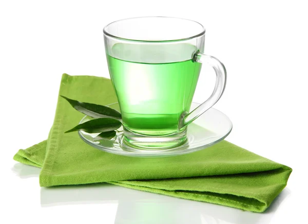 Transparente Tasse grüner Tee auf Serviette, isoliert auf weiß — Stockfoto