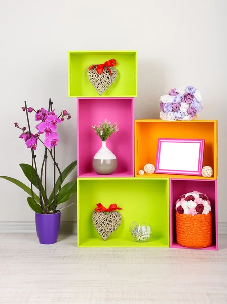 Beautiful colorful shelves with different home related objects — Stock Photo, Image