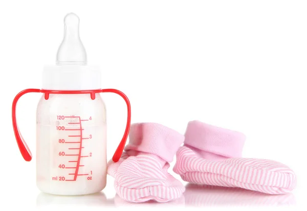 Bottle for milk formula with booties isolated on white — Stock Photo, Image