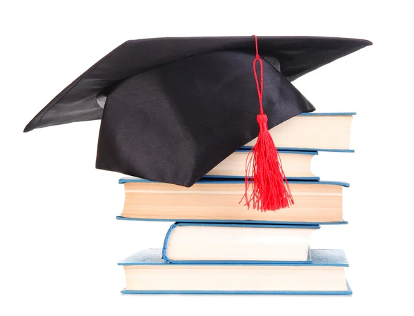 Cappello Grad con libri isolati su bianco — Foto Stock