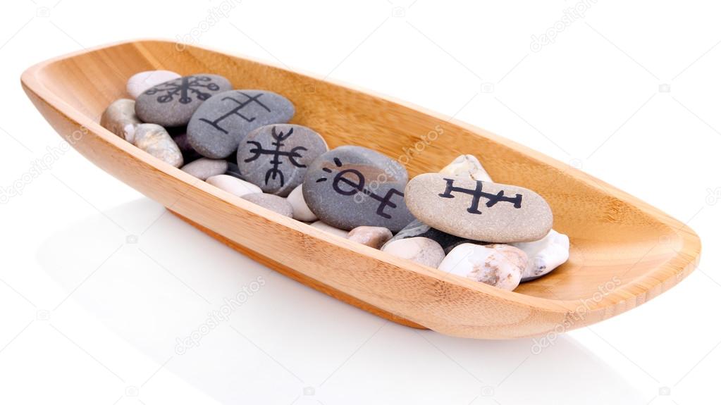 Fortune telling with symbols on stones in wooden bowl isolated on white