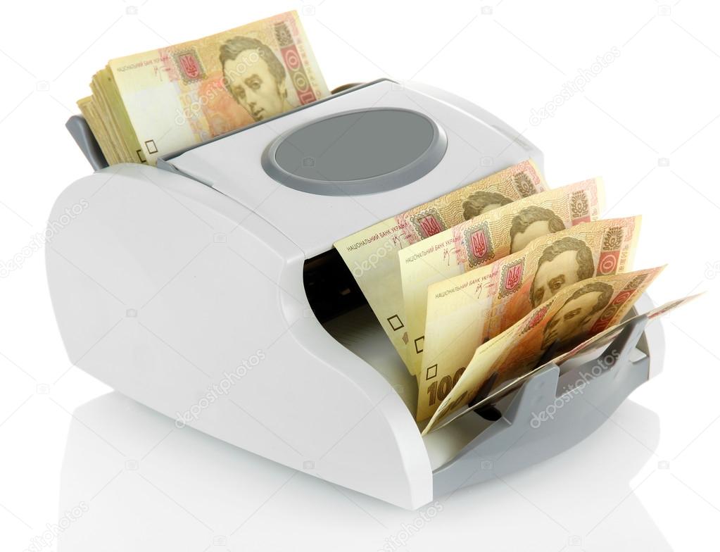 Machine for counting money with Ukrainian money, isolated on white