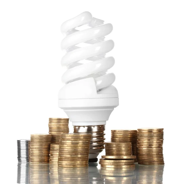 Energiebesparende lamp en geld geïsoleerd op wit — Stockfoto