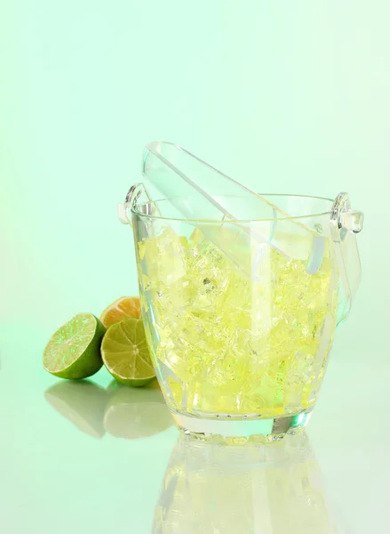 Ice in the bucket on different backgrounds — Stock Photo, Image