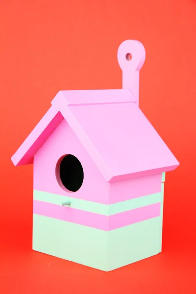 Decorative nesting box on color background — Stock Photo, Image