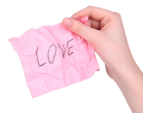 Liebeswort auf Zettelpapier in der Hand isoliert auf weiß — Stockfoto