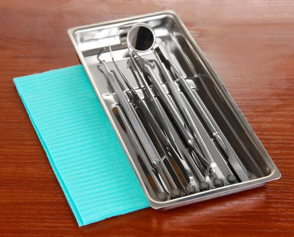 Dentist tools on wooden table — Stock Photo, Image