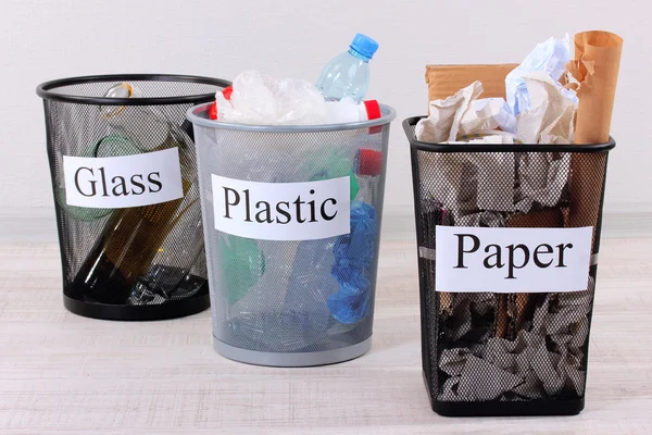 Three buckets of assorted debris on room background — Stock Photo, Image