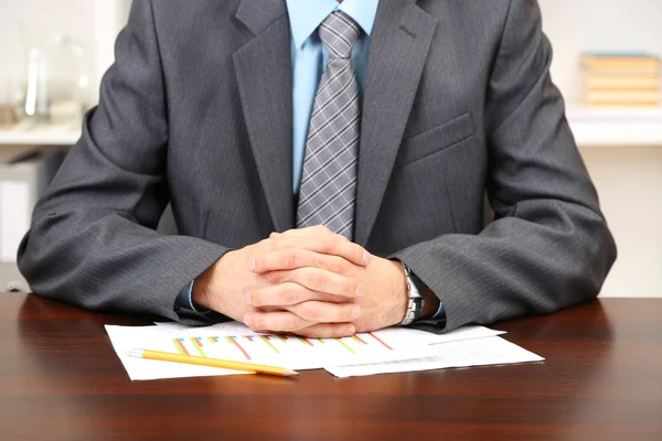 Young businessman in office at his workplace — Stock Photo, Image