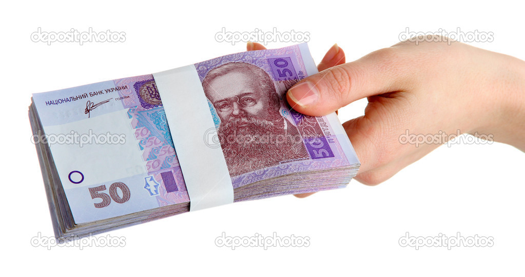 Ukrainian money in hand, isolated on white