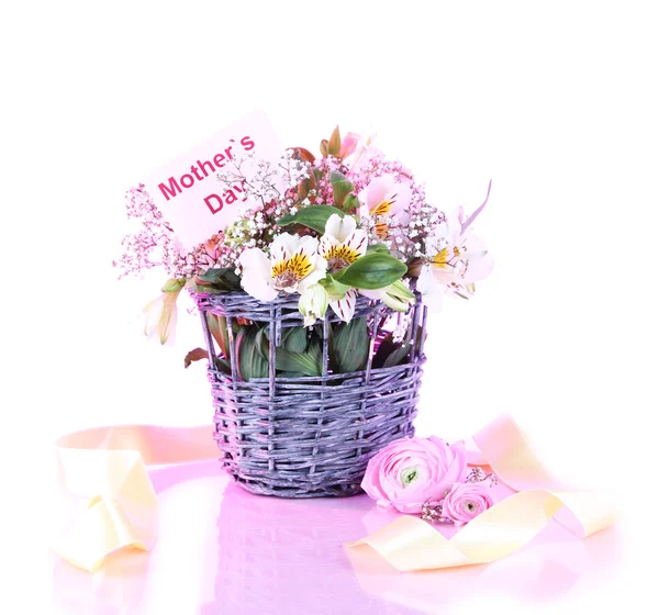 Bouquet of flowers in basket on pink background — Stock Photo, Image