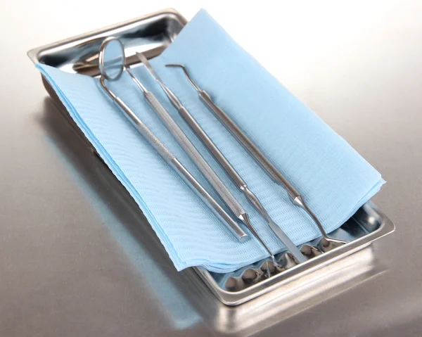 Dentist tools on grey table close-up — Stock Photo, Image