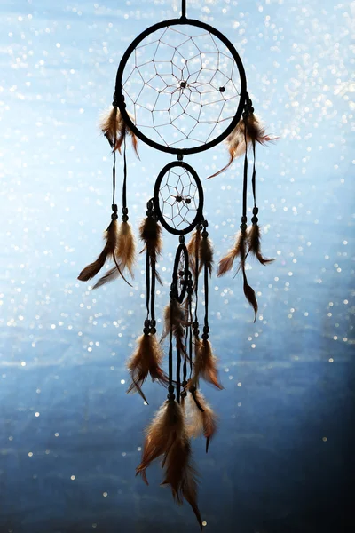 Beautiful dream catcher on blue background with lights — Stock Photo, Image