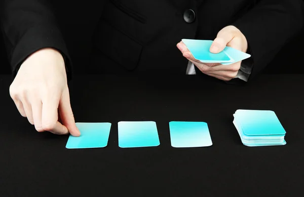 Hand with business cards. Concept: Business like poker game. Isolated on black — Stock Photo, Image