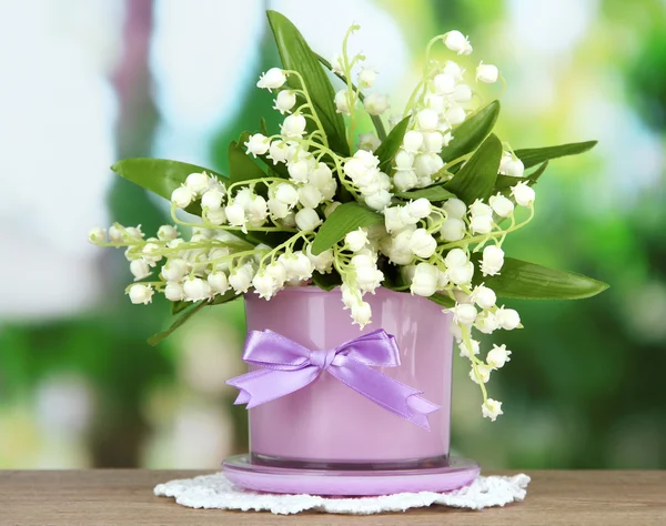 Beautiful lily of the valley in vase on nature background — Stock Photo, Image