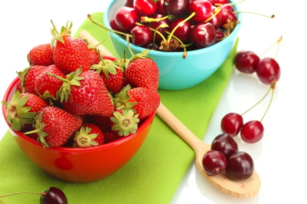 Ripe strawberries and cherry berries in bowls isolated on white — Stock Photo, Image