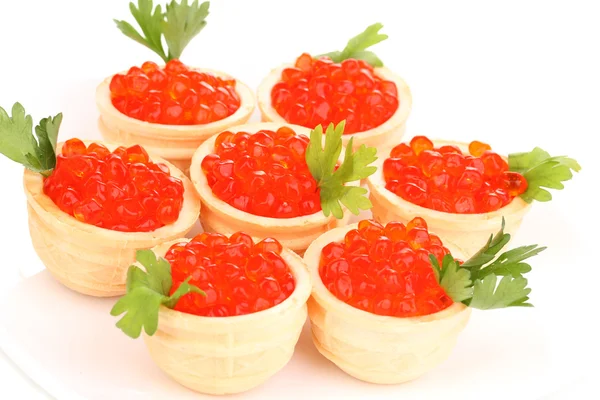 Red caviar in tartlets on white plate close-up — Stock Photo, Image