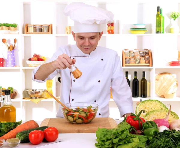 Chef cooking in kitchen — Stock Photo, Image