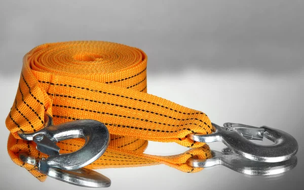 Tow rope for car on grey background — Stock Photo, Image