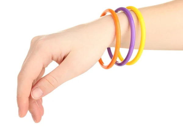 Kleurrijke mode armbanden op vrouw hand geïsoleerd op wit — Stockfoto