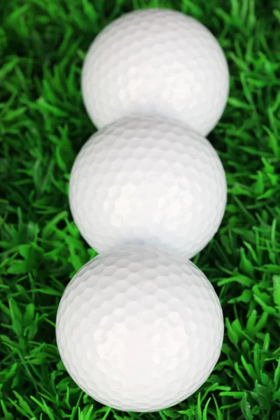 Golf balls on grass close up — Stock Photo, Image