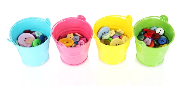 Colorful buttons in buckets isolated on white — Stock Photo, Image