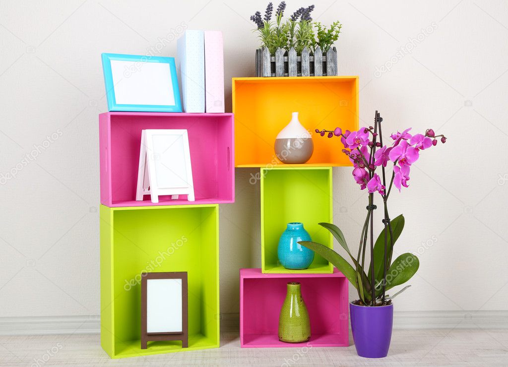 Beautiful colorful shelves with different home related objects