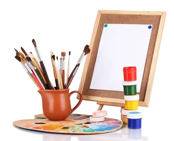 Small easel with sheet of paper and art supplies isolated on white — Stock Photo, Image