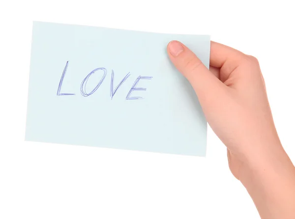 Palavra de amor sobre papel de peça na mão isolado em branco — Fotografia de Stock
