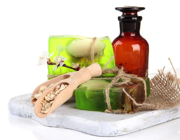 Hand made soap and ingredients for soap making, isolated on white — Stock Photo, Image