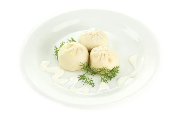 Tasty khinkali on plate, isolated on white — Stock Photo, Image