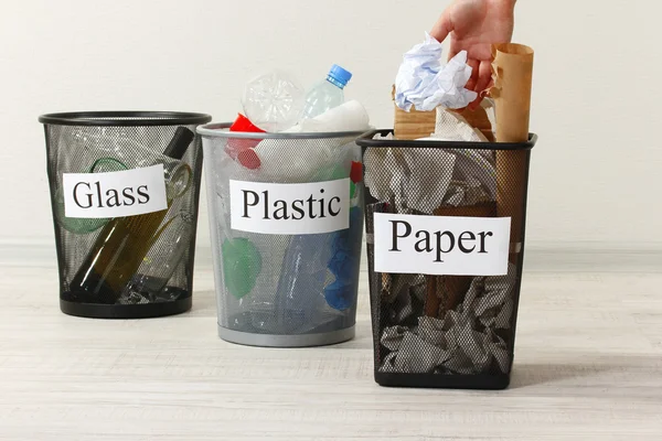 Three buckets of assorted debris on room background — Stock Photo, Image