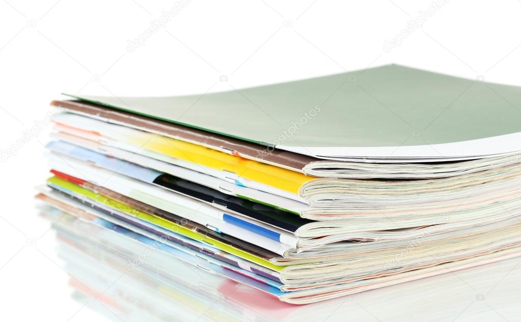 Many magazines isolated on white